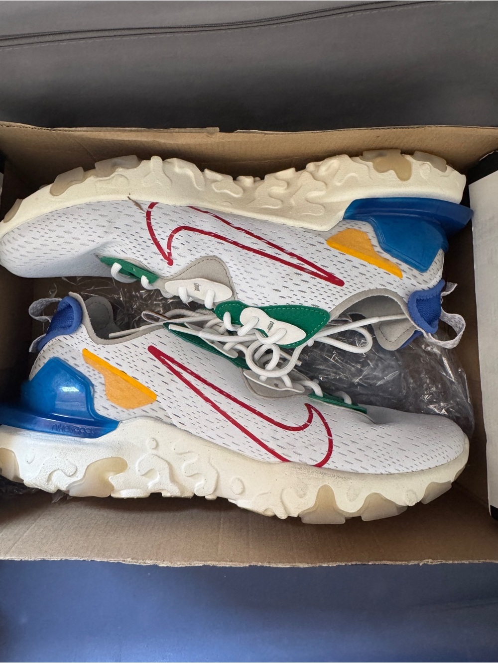Nike Men’s White Sneakers with Red Swoosh and Blue, Green & Yellow Accents
